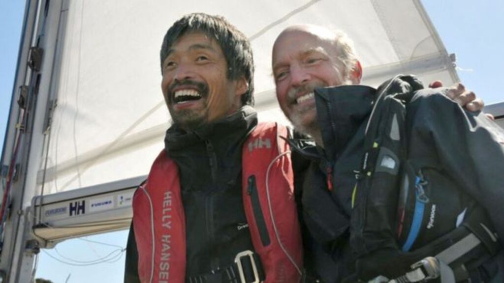 Mitsuhiro Iwamoto, a blind Japanese sailor, celebrates with his navigator Doug Smith of the U.S. after successfully completing a near two-month, non-stop voyage from San Diego to Fukushima Prefecture on the Pacific Ocean, upon their arrival at Onahama port in Iwaki, Fukushima prefecture, Japan, in this photo taken by Kyodo April 20, 2019.