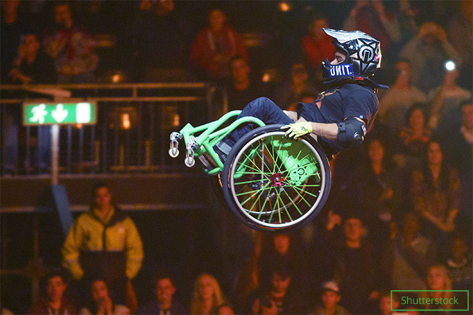 Picture of Aaron Fotheringham flying through the air on his wheelchair.