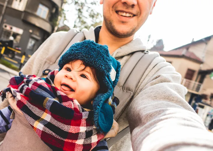 Another picture of a father holding his baby.