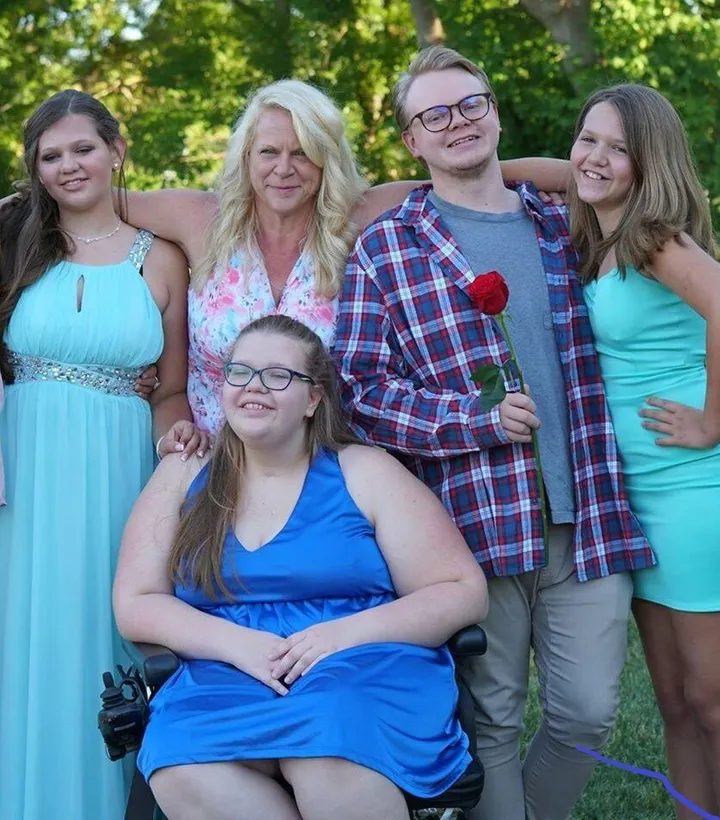 Picture of Christine and Emma with Emma's siblings and mother.