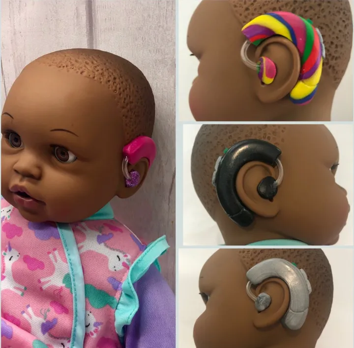 Picture of dolls with different hearing aid customizations.