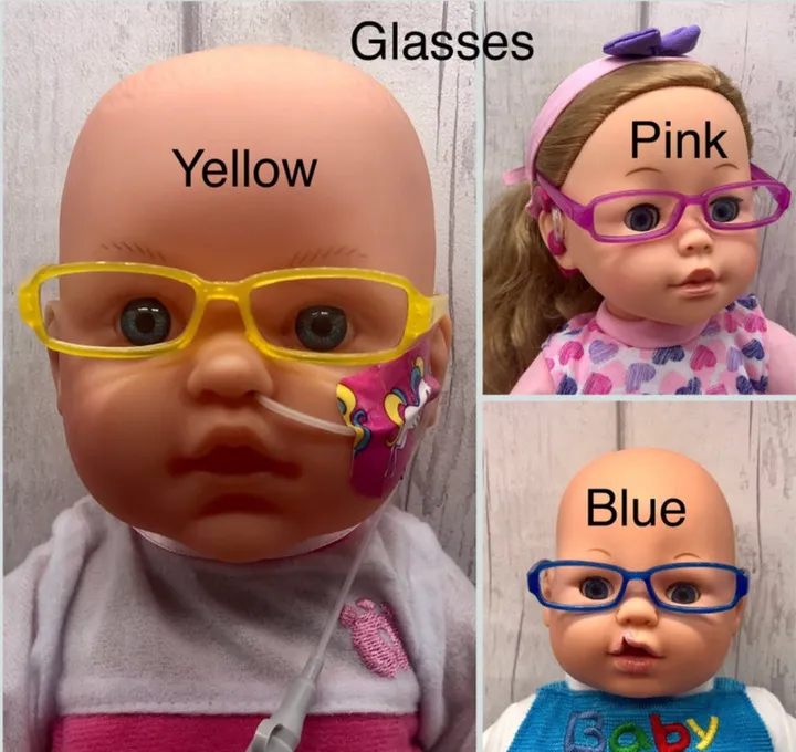 Picture of dolls with different colored glasses.