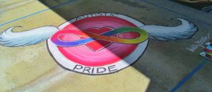 Picture of chalk art created by Kelly Green to represent autistic pride.