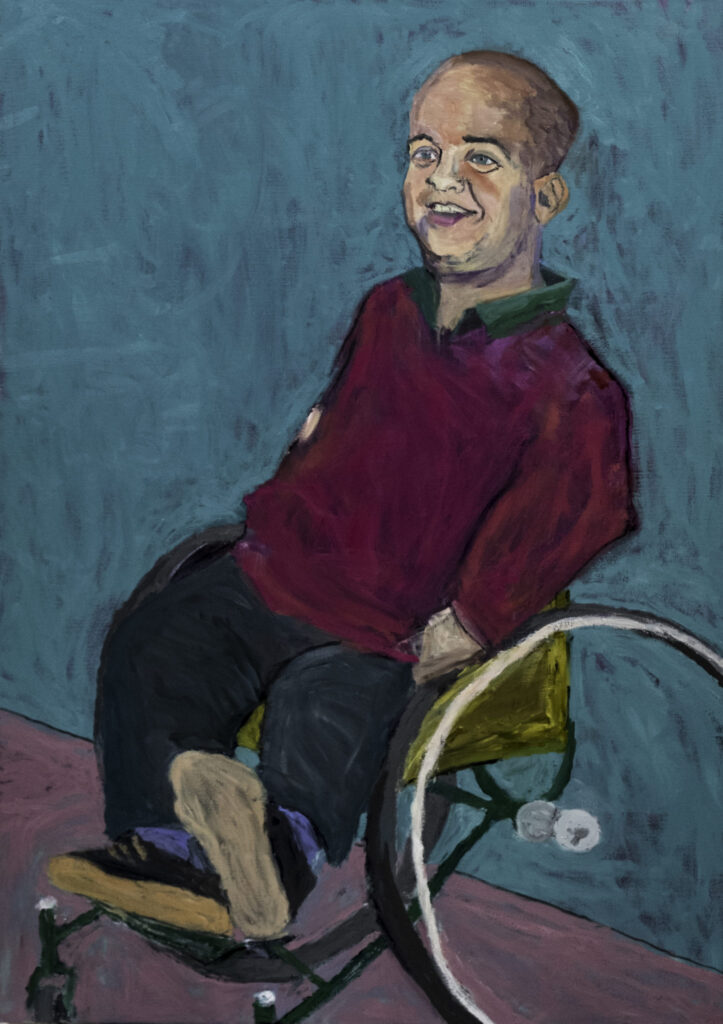 A portrait of Tom Shakespeare in his wheelchair.