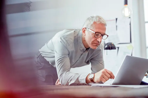 Picture of man on a laptop.