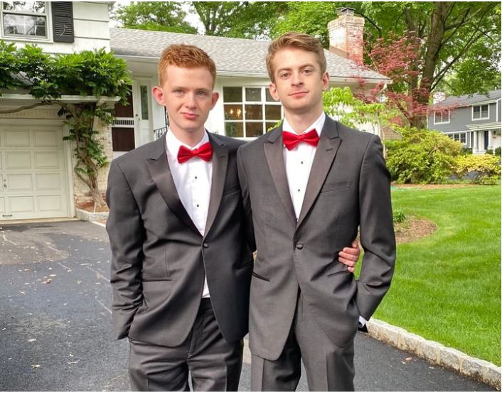 Picture of the author's sons, Jonah (right) and Ian (left), posing for prom pictures on their front lawn.