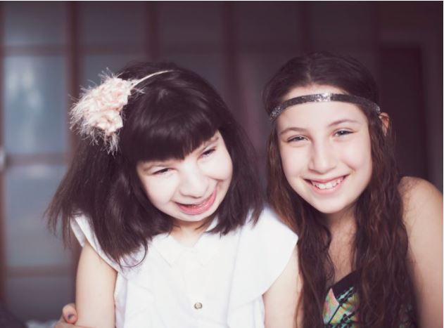 Picture of Emma (left), on her 16th birthday, with her sister Hanna (then 12 years old).