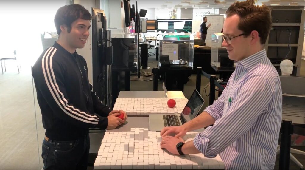 Picture of Daniel Levine (left), then a master’s student at MIT’s Tangible Media Group in Cambridge, worked on the TRANSFORM device at the lab along with computer scientist Woodbury Shortridge (right).