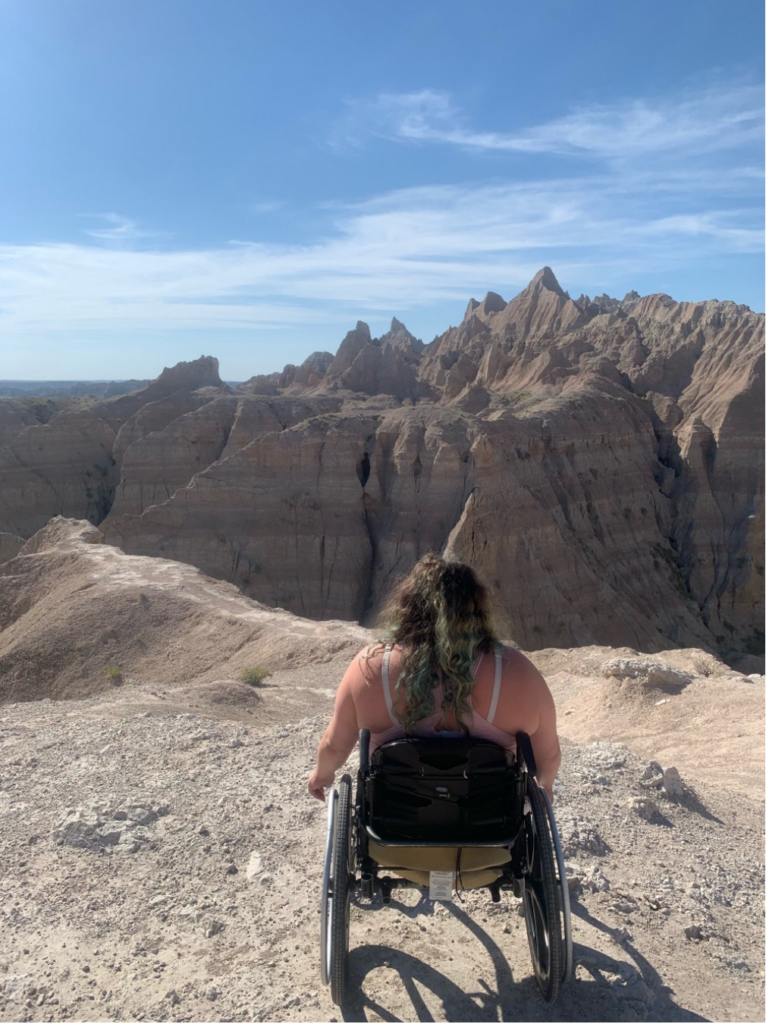 Picture of the authors sister, a bi-lateral amputee, visiting Badlands National Park.