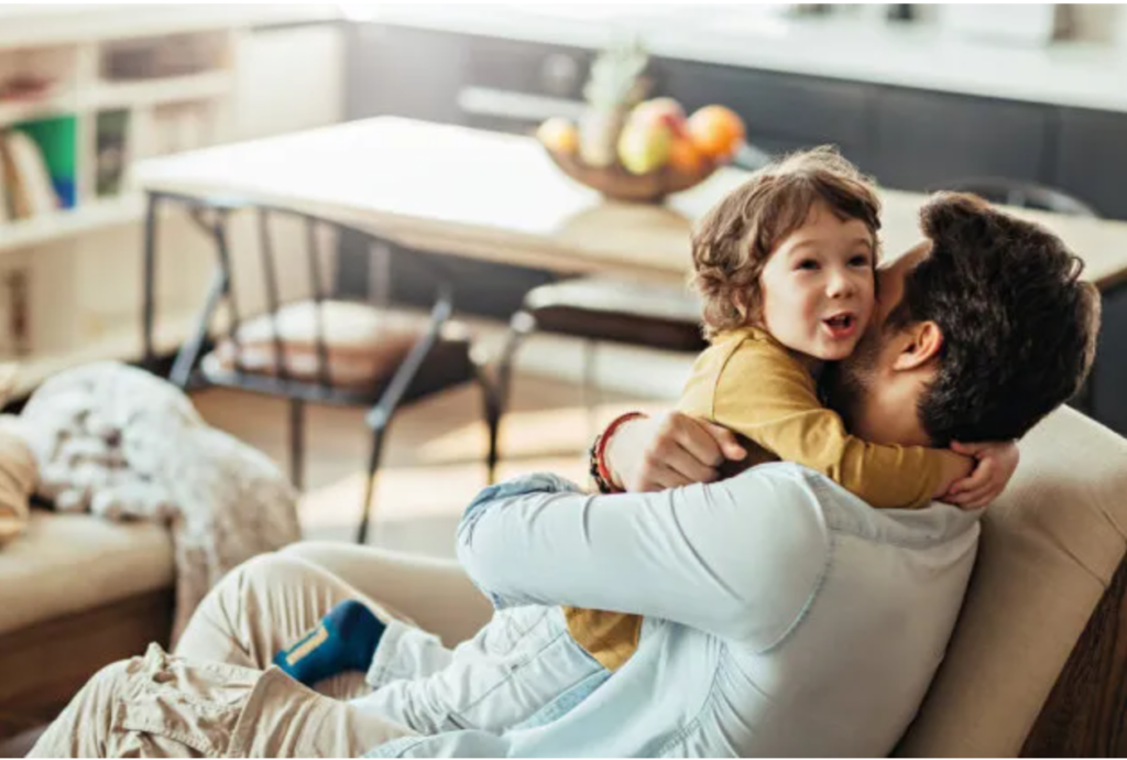 Picture of a father playing with his son.