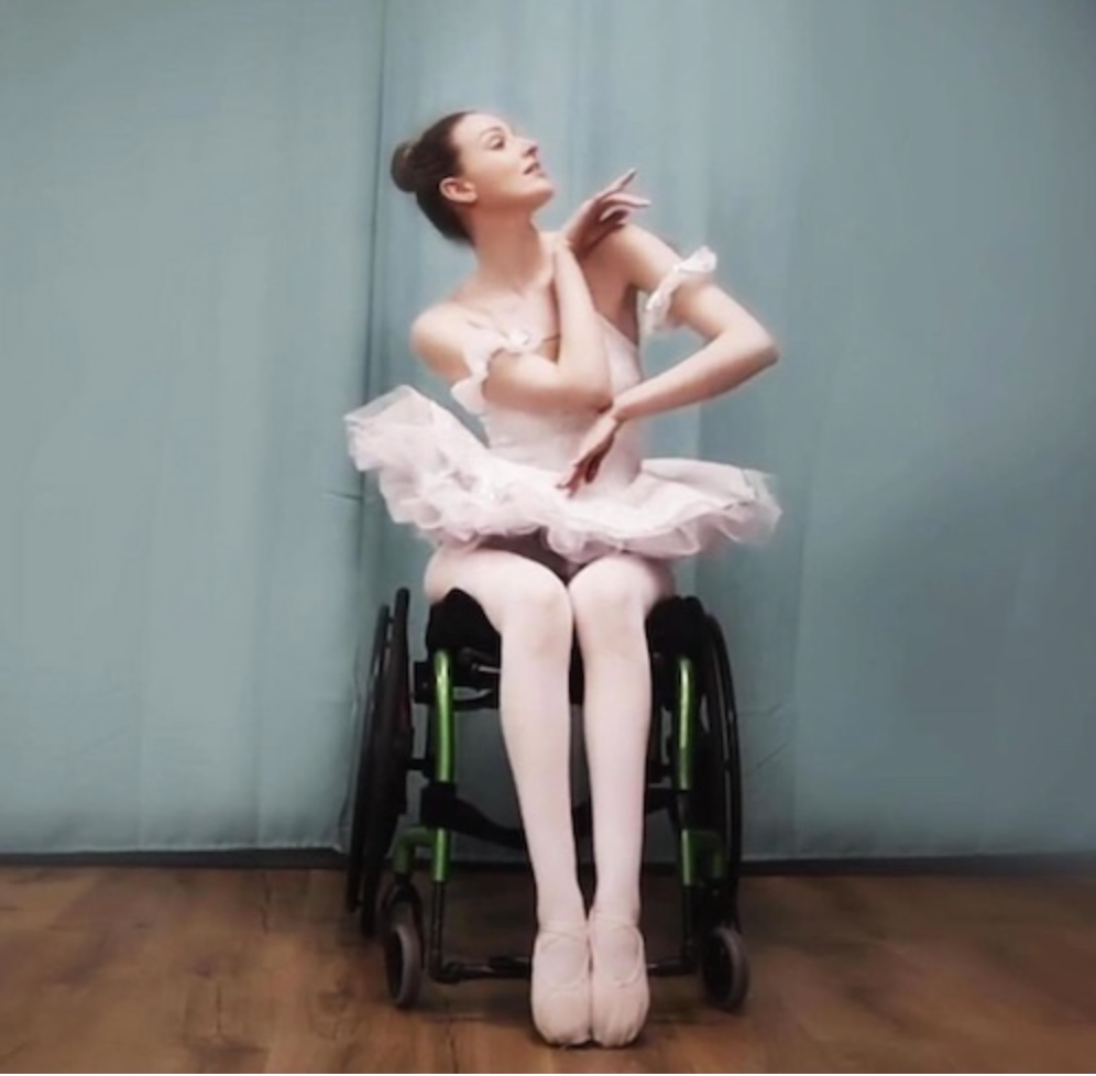 Picture of Kate Stanforth in her wheelchair wearing a ballerina outfit.