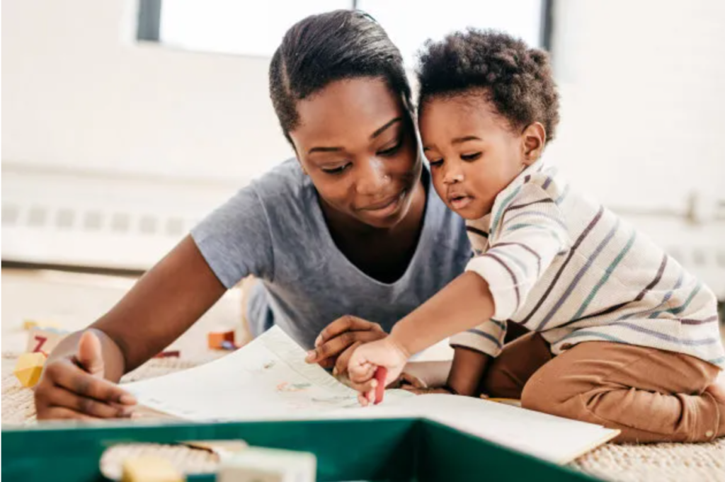 Picture of a mother drawing with her son.