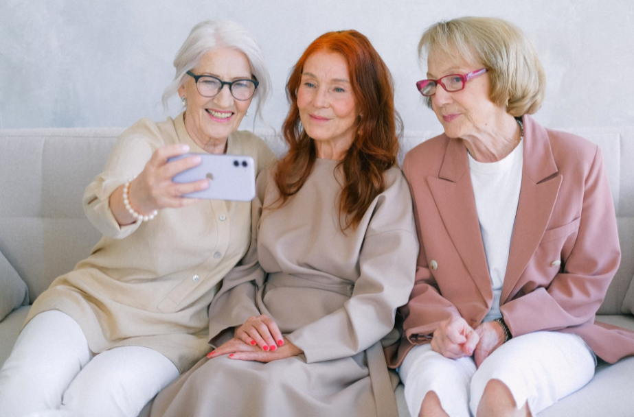 Picture of three older women taking a selfie.