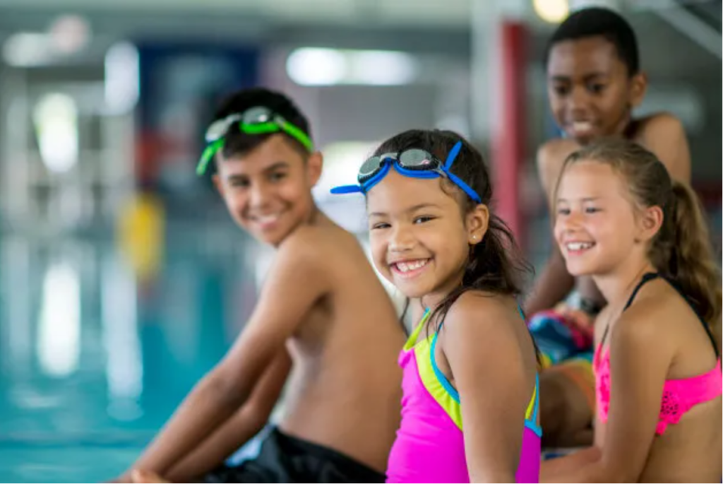 Picture of younger kids at a pool.