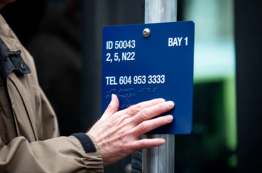 Image of a blue braille sign.