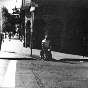 Center for Independent Living director Phil Draper at the corner of Telegraph Avenue and Blake Street in 1984 from Going Where You Wheel on Telegraph Avenue