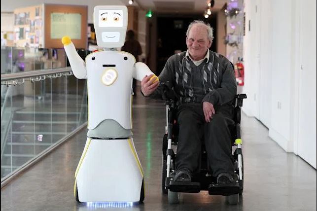 IrelandÕs first socially assistive AI robot 'Stevie II' from robotics engineers at Trinity College Dublin, with Brendan Crean, who helped trial the robot through the charity ALONE, during a special demonstration at the Science Gallery in Dublin. (Photo by Brian Lawless/PA Images via Getty Images)