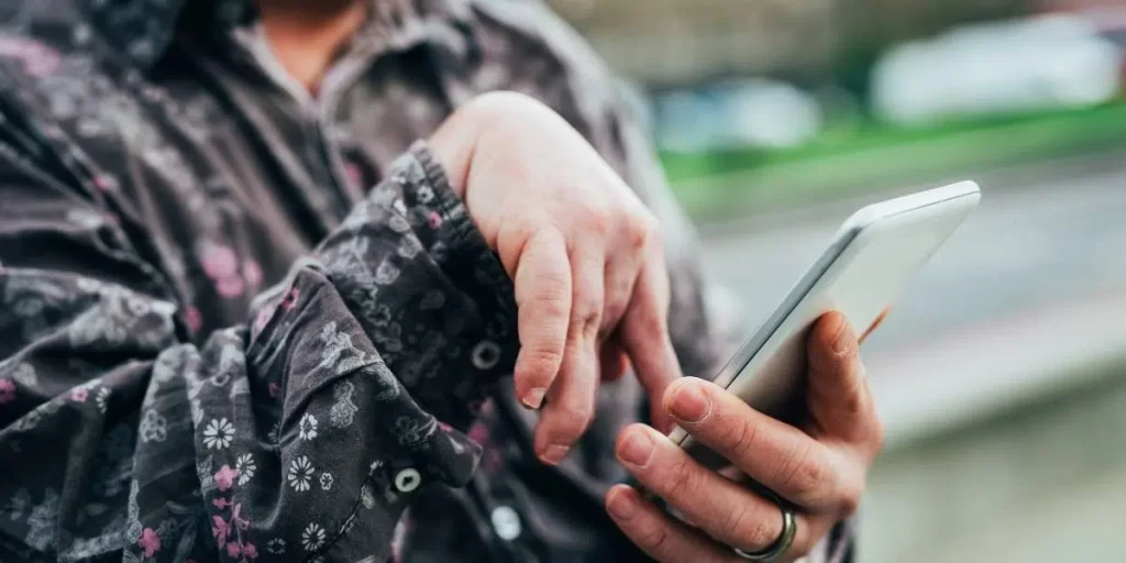 Person using a cell phone.