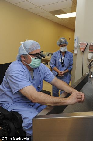 Dr. Rummel washing up for surgery