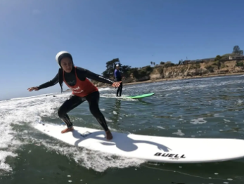 Haben Girma surfing in Santa Cruz, California.