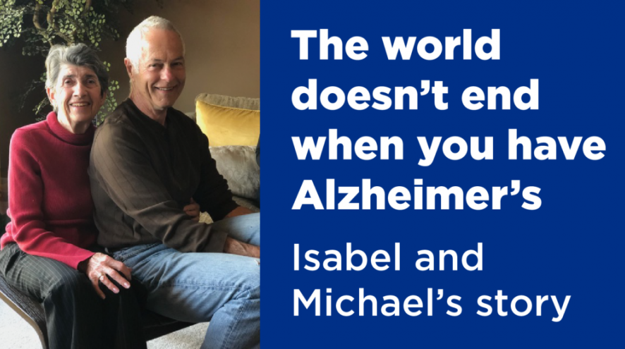Isabel and Michael sit together. A blue and white text box is beside them that reads, "The world doesn't end when you have Alzheimer's. Isabel and Michael's story."